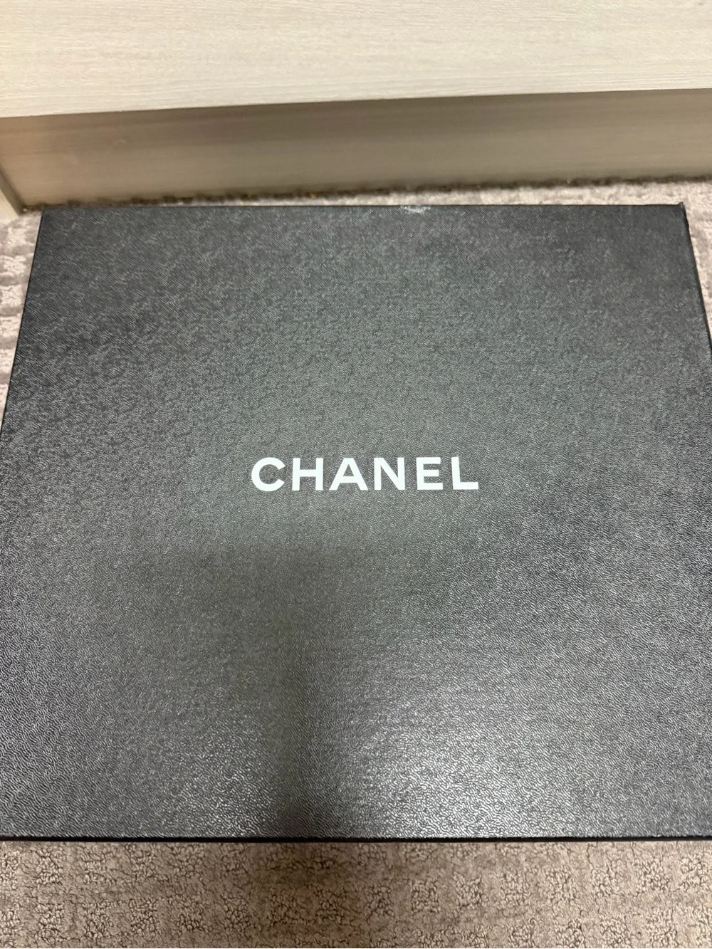 CHANEL White and Black High-Top Logo Sneaker